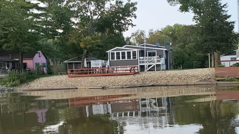 River frontage , deck and115 ft.  dock your toys. Room for entering Canue/kayak 