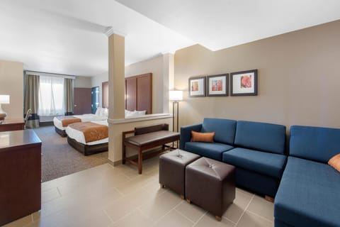 Premium bedding, desk, laptop workspace, blackout drapes