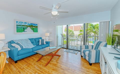 Bright and inviting living area with coastal decor and natural light