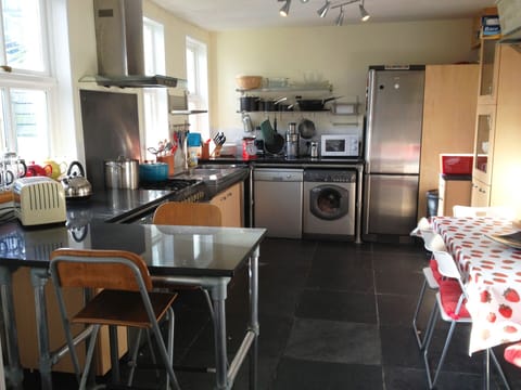 large kitchen showing four seater table
