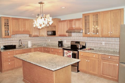Modern kitchen fully equipped to cook for a large group--toaster & coffee maker