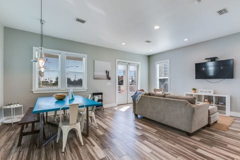 East Point Cottages offers a modern, open floor plan! Watch TV from the living room, dining room, or kitchen!