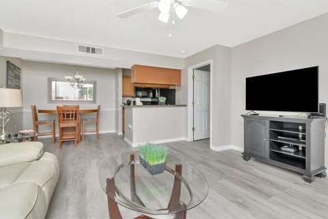 Bright and open living room with modern kitchen access