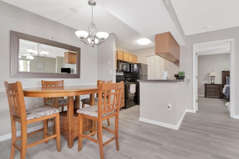 Bright dining area with modern kitchen and open layout