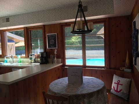 Built in banquette in kitchen...view of pool!  