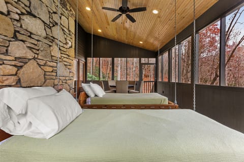 The Huntley features Swinging Beds on a Screened in Porch.