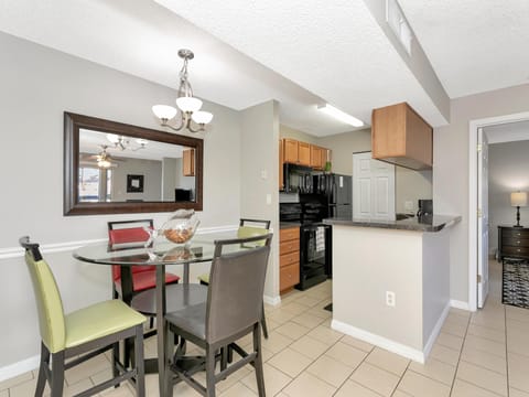 Bright dining area with modern kitchen and cozy seating