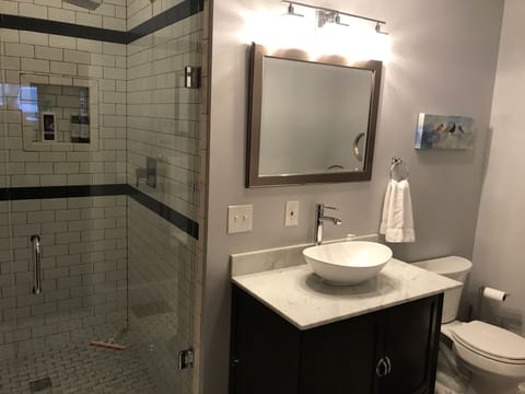 Large walk-in, subway tiled shower with rainhead!
