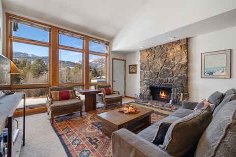 Living Room w/ Fireplace and Deck