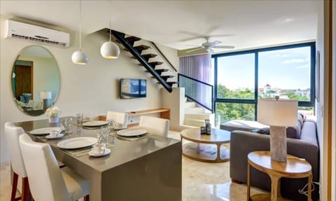 Living room, stairs leading to the second bedroom and private rooftop
