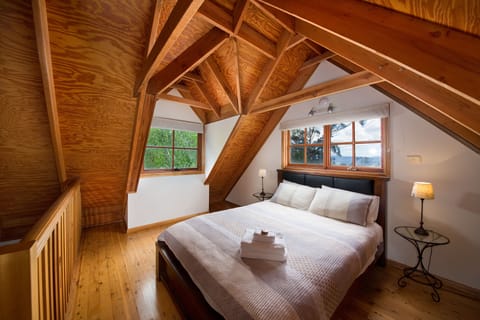 Large main loft bedroom with views of the Kanimba valley
