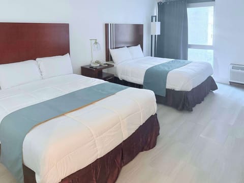 Standard Room, 2 Queen Beds, Non Smoking | Desk, iron/ironing board, WiFi (free), bed sheets