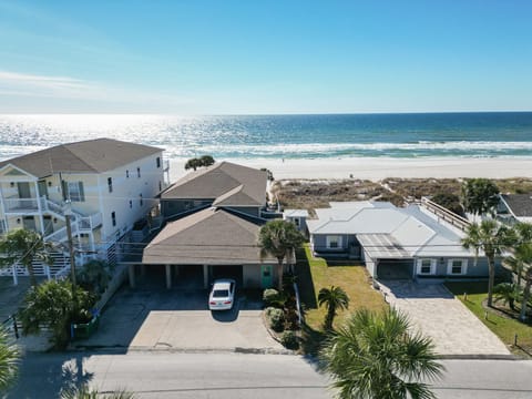 Locate4d Directly on Panama City Beach Parking for 5 - 6 vehicles 3 spots are covered (Center House White Car)