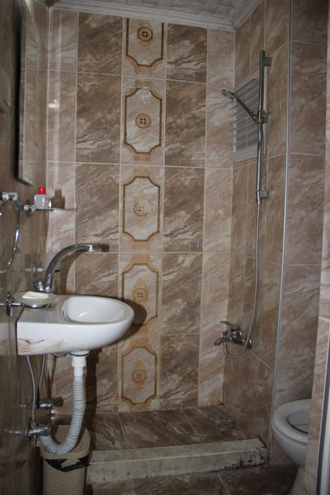 Shower, free toiletries, hair dryer, slippers