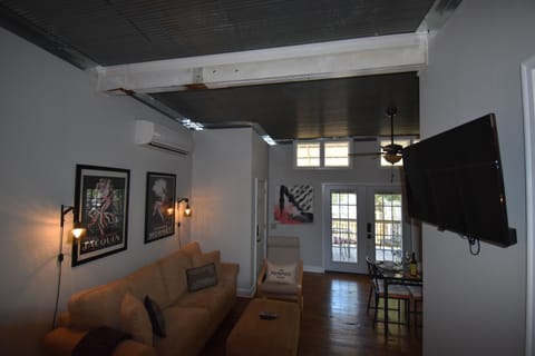 Sofa with Queen pull out bed, large wall mounted TV with DirecTV and Roku