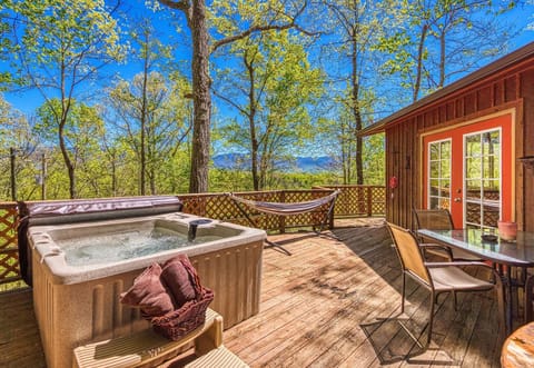 Back deck with hot tub, hammock and outdoor seating.views from the hot tub.
