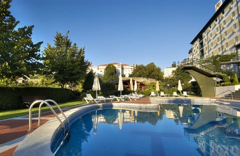 Seasonal outdoor pool, open 10:00 AM to 7:00 PM, sun loungers