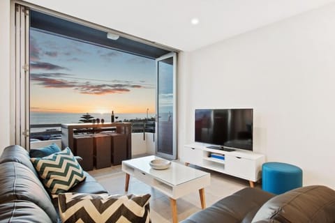Relaxing lounge,opening bifold door to balcony with beautiful views of the ocean