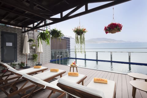 Outdoor pool, open 6:00 AM to 10:00 PM, pool umbrellas, sun loungers