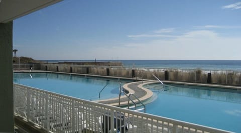 View of the large heated freshwater pool & Gulf of Mexico just steps from patio
