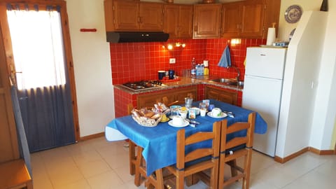 Panoramic Condo, 2 Bedrooms, Sea View, Beachfront | Private kitchen | Full-size fridge, stovetop, cookware/dishes/utensils, cleaning supplies