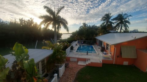 Enjoy relaxing in and around the pool, overlooking a secluded canal