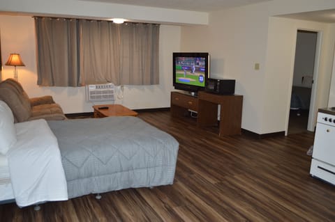 Luxury Apartment | Living area | 60-inch flat-screen TV with cable channels