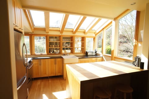 Sun-drenched kitchen, farm sink, microwave, dishwasher, fridge & gas stove