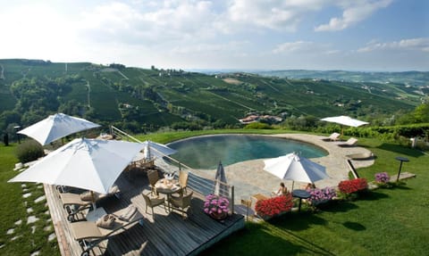 Seasonal outdoor pool, open 10:30 AM to 7:30 PM, pool umbrellas