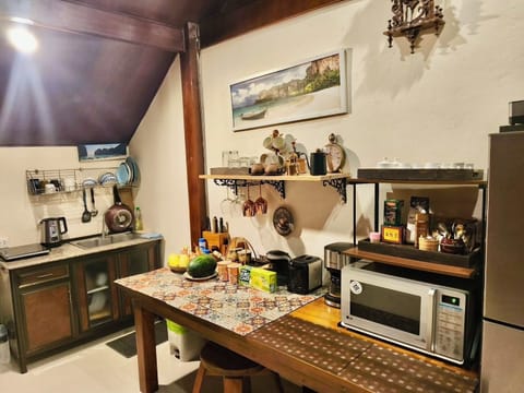 Full-size fridge, microwave, stovetop, coffee/tea maker