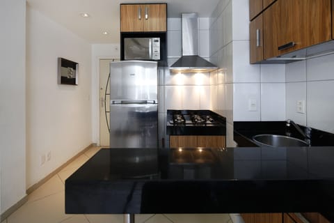 Apartment | Private kitchenette | Full-size fridge, microwave, stovetop, cookware/dishes/utensils
