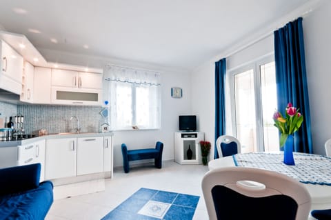 Apartment, 2 Bedrooms | Private kitchen | Full-size fridge, stovetop, cookware/dishes/utensils