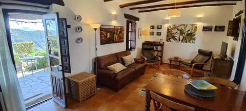 Spacious living room with access to terrace.