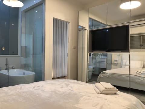 Deluxe Apartment, 3 Bedrooms | Living area | Flat-screen TV