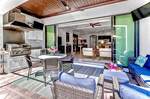 Large lanai with TVs and outdoor kitchen