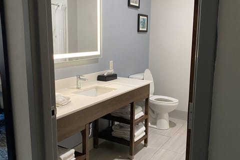 Desk, laptop workspace, blackout drapes, iron/ironing board