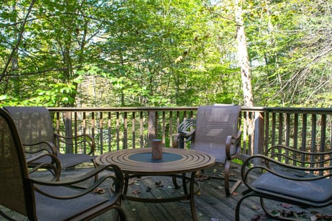 utdoor social seating on the back deck overlooking the river.