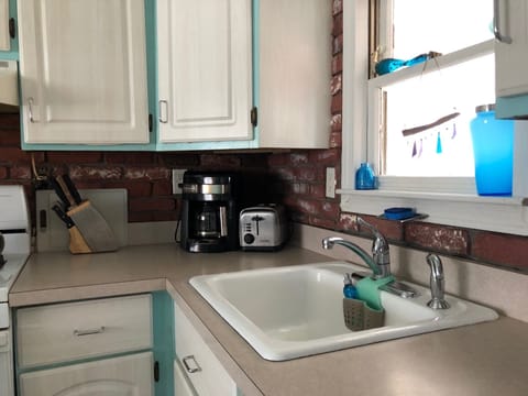 Coffee maker has built-in filter.