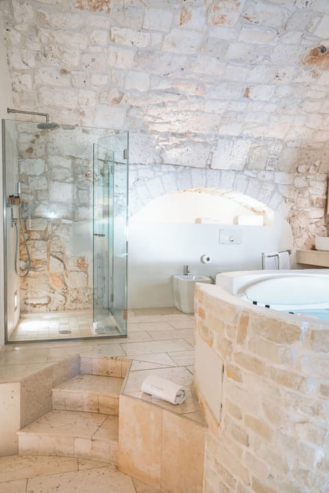 Suite Master | Bathroom | Designer toiletries, hair dryer, bathrobes, slippers