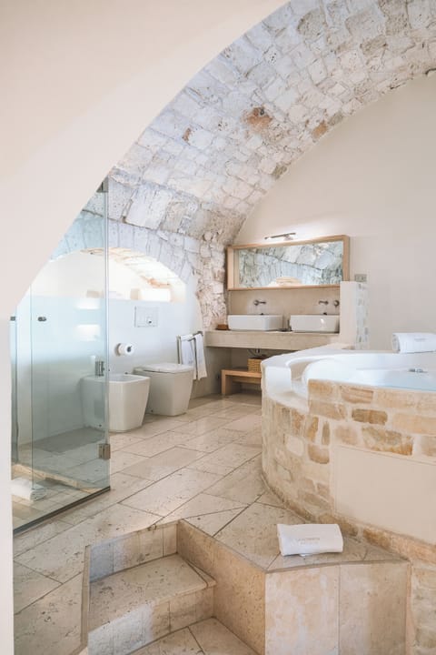 Suite Master | Bathroom | Designer toiletries, hair dryer, bathrobes, slippers
