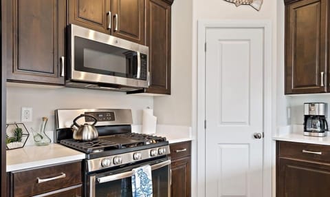 Top of the line stainless steel appliances featuring a tea kettle