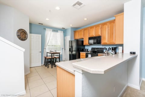 This stylish kitchen captures the essence of modern design, blending functionality and aesthetics seamlessly for a perfect cooking and gathering space.