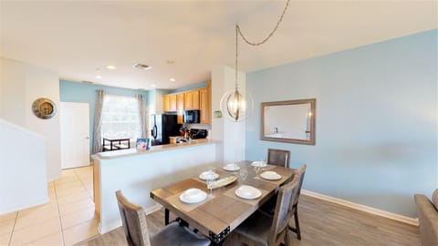 Dining area- With a sophisticated design blending modern and classic elements, the strategic use of mirrors enhances the perception of space, creating an inviting atmosphere.