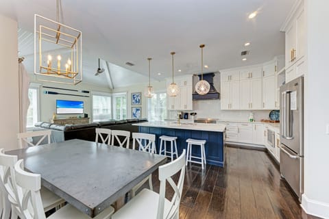 Dining room looking into kitchen and living room