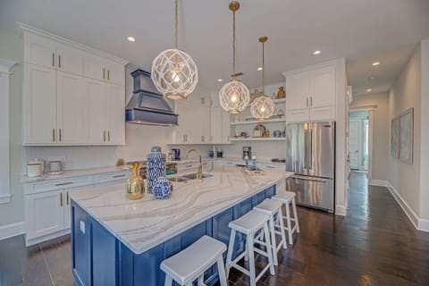 Large coastal kitchen with plenty of cabinet and countertop space