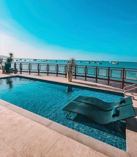 Outdoor pool, open 7:00 AM to 10:00 PM, sun loungers