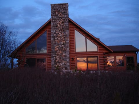 Sunset reflected in the expansive windows facing Shank Painter pond.
