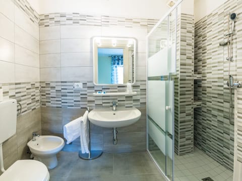 Shower, free toiletries, hair dryer, towels