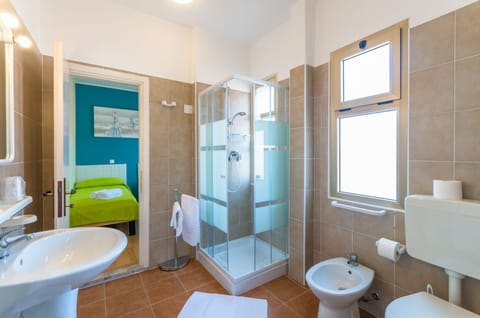 Family Room, 2 Bedrooms | Bathroom | Shower, free toiletries, hair dryer, towels