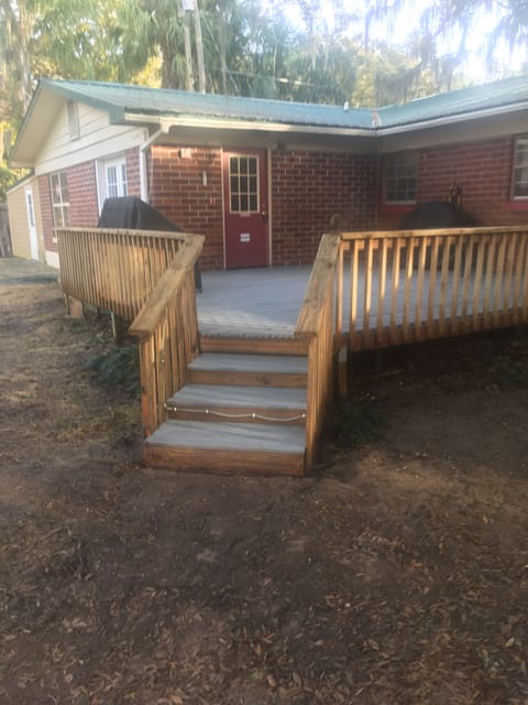 The Renovated composite Deck lakeside entrance, and gas grill
